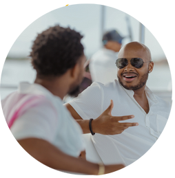 Two Black Men Talking on a boat